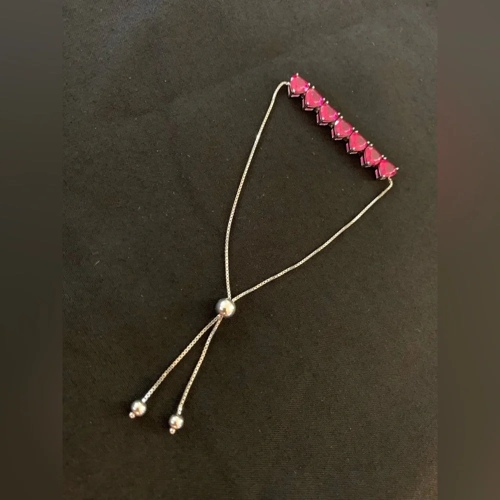 Rhodium over sterling silver lab ruby heart bolo bracelet